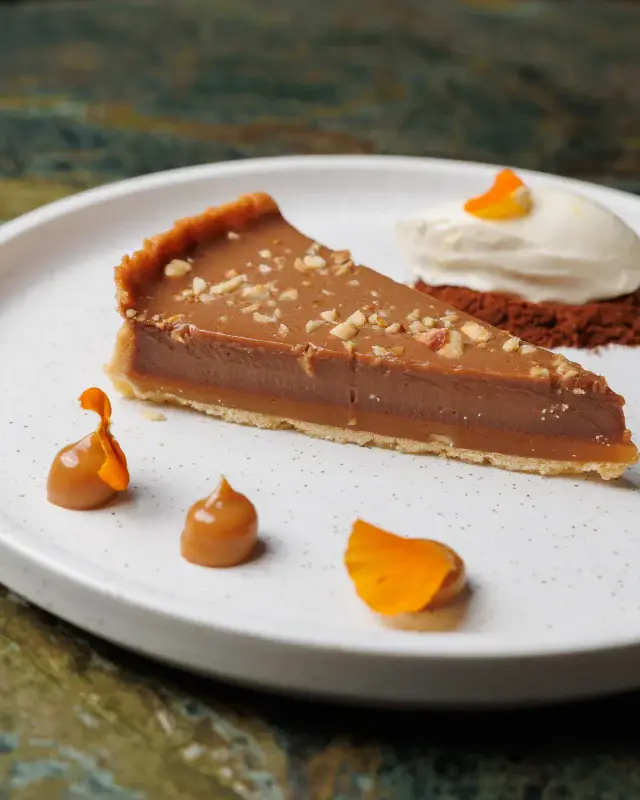 Meet the sweet: Housemade Gianduja tart, with a moorish layer dulce de leche, served alongside a refreshing lemon and vanilla mousse. 

This is one of those after dinner treats that just hits the spot with a balance of sweetness, nuttiness, crunch & zest.

For those wondering what actually is Gianduja (Jahn-DOO-yuh), it’s a paste made from only the best combo in the world: chocolate & hazelnut. 

Watch out, Tiramisu. This kid is competing for our top spot.

ENOTECA
281 Rundle Street